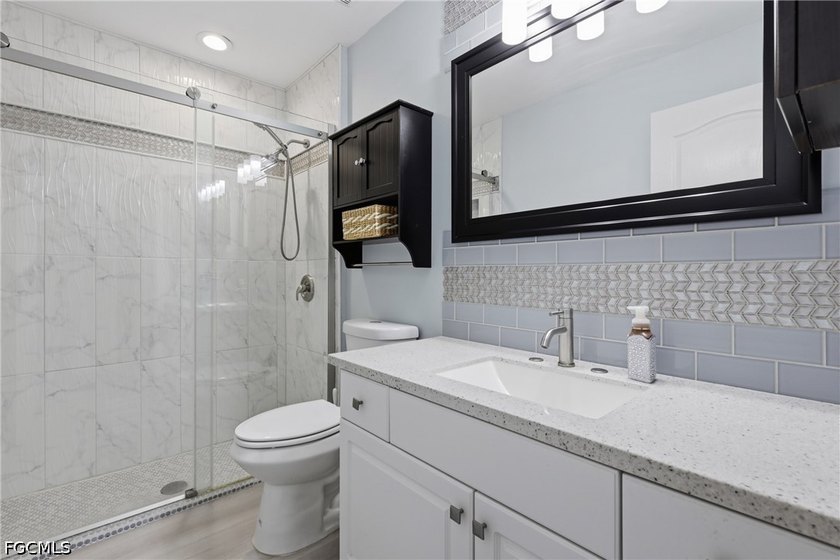 Luxuriously renovated and truly move-in ready! Like new, but - photo 22