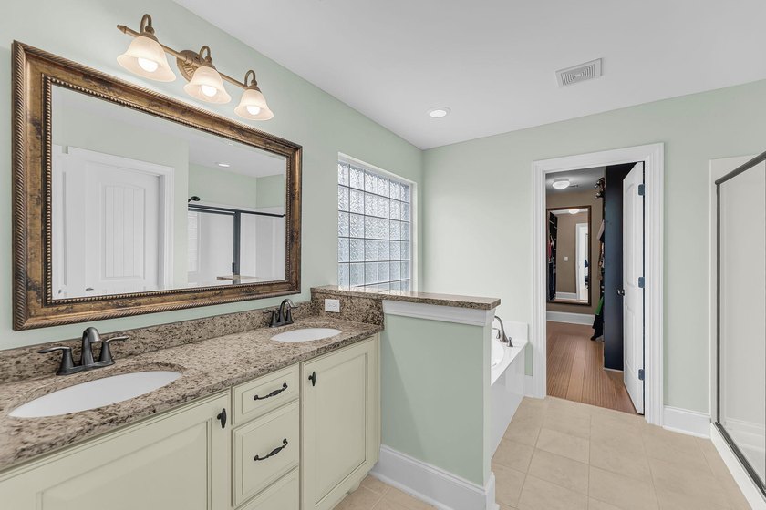 Nestled on a desirable corner lot, this beautiful two-story home - photo 25