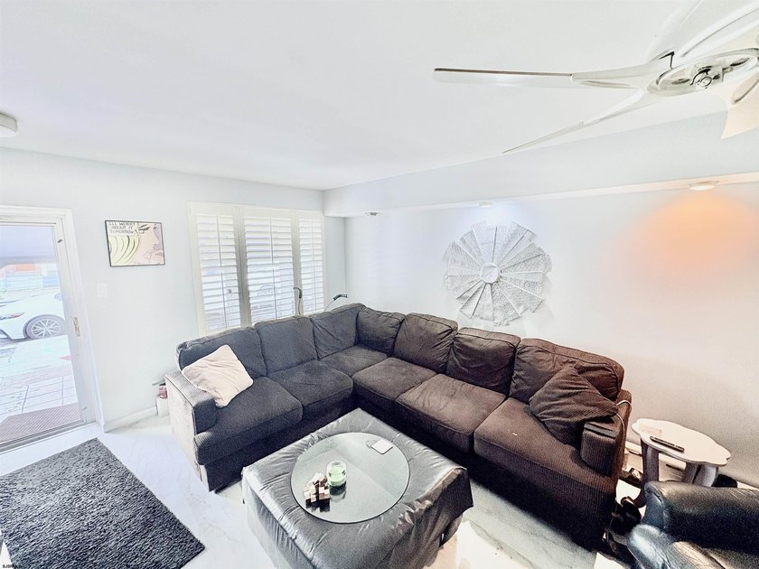 Adorable townhouse boasting an open and inviting floor plan. The - photo 3