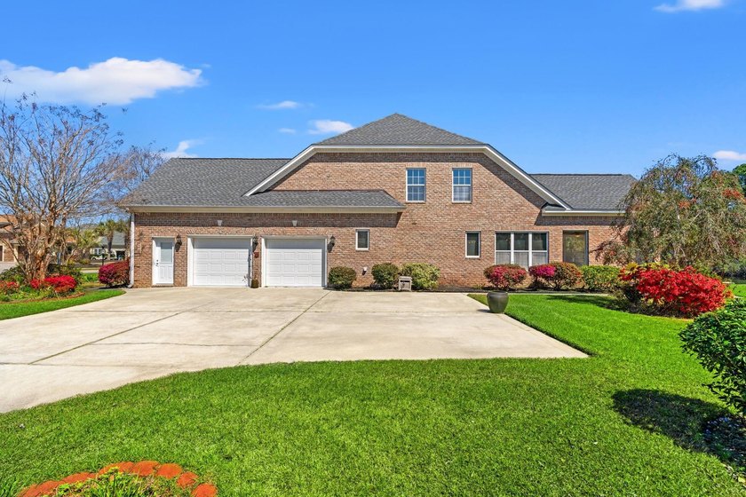 Nestled in a beautiful lakefront setting, this all-brick - photo 3