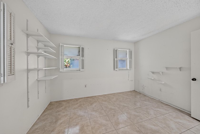 Desirable first-floor end unit in Sunrise Lakes Phase One! This - photo 15