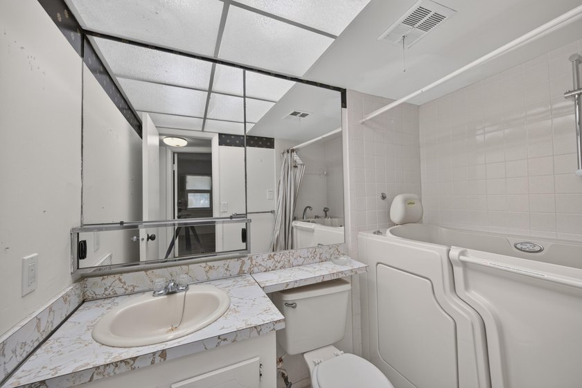 Desirable first-floor end unit in Sunrise Lakes Phase One! This - photo 16