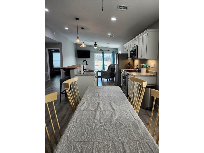 This almost-new home comes fully furnished and ready to make - photo 4