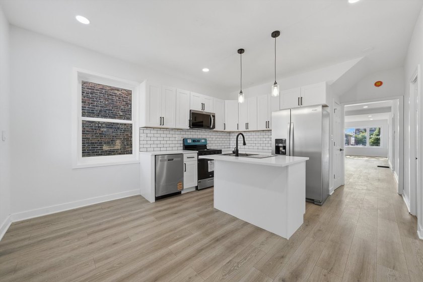Step into this spacious 4 bedroom, 3 bathroom home set on a - photo 6