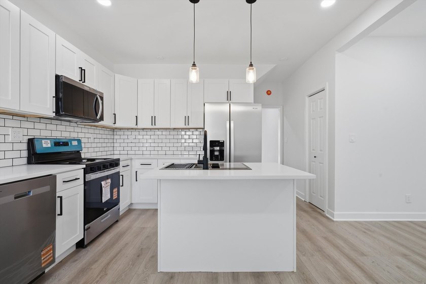 Step into this spacious 4 bedroom, 3 bathroom home set on a - photo 7
