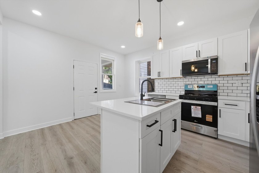 Step into this spacious 4 bedroom, 3 bathroom home set on a - photo 8