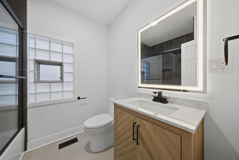 Step into this spacious 4 bedroom, 3 bathroom home set on a - photo 10