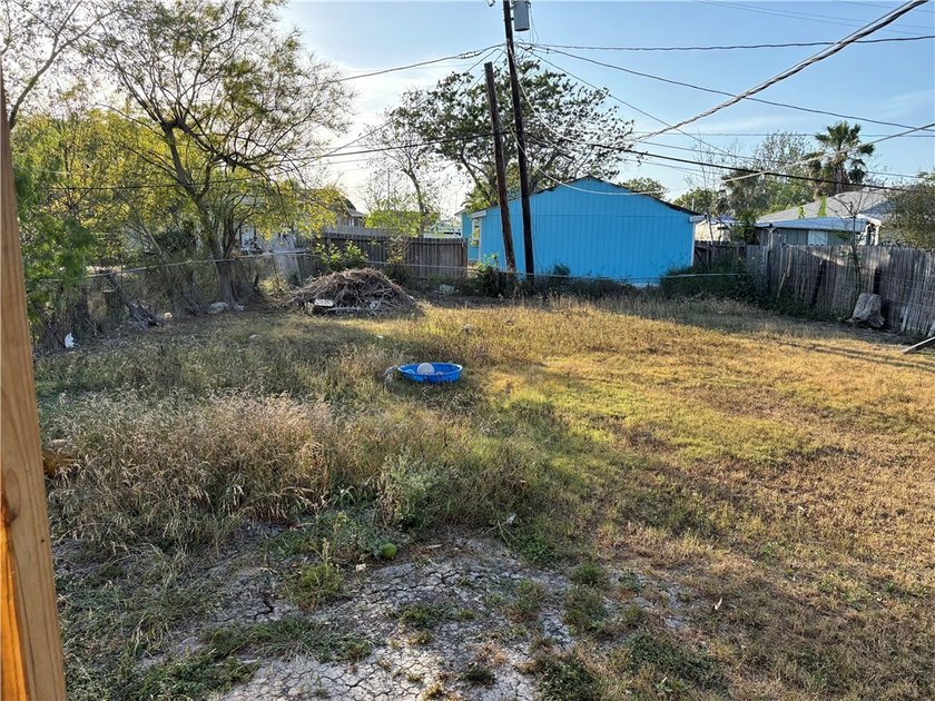 This 3-bedroom, 1-bath home sits on a large lot and offers - photo 12