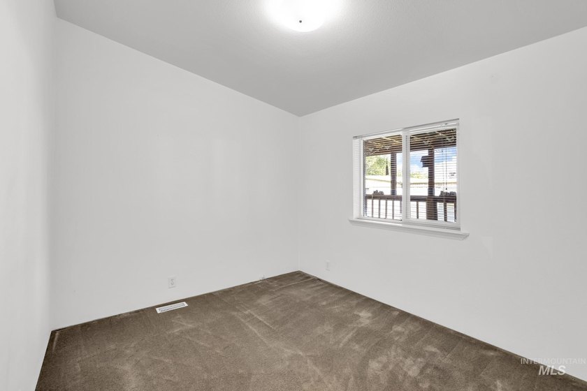 Welcome home to this inviting 3-bedroom, 2-bath manufactured - photo 11