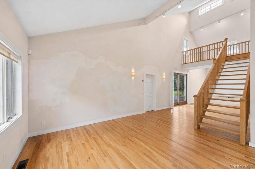 Set on a private 1.18-acre property in Hampton Bays, this - photo 12