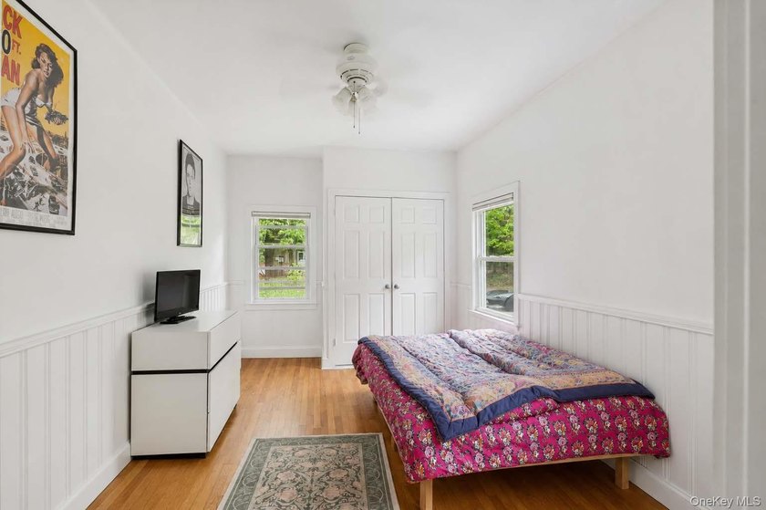 Set on a private 1.18-acre property in Hampton Bays, this - photo 20