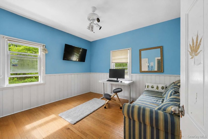 Set on a private 1.18-acre property in Hampton Bays, this - photo 22