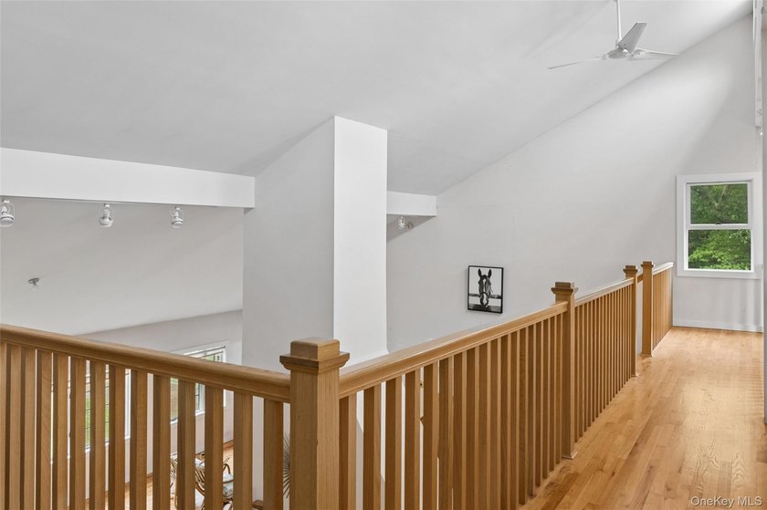 Set on a private 1.18-acre property in Hampton Bays, this - photo 27
