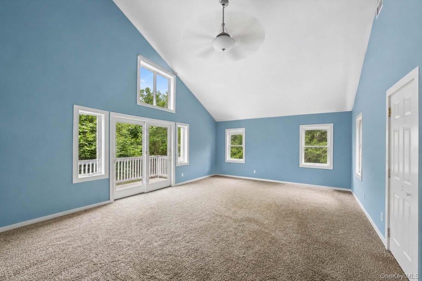 Set on a private 1.18-acre property in Hampton Bays, this - photo 29