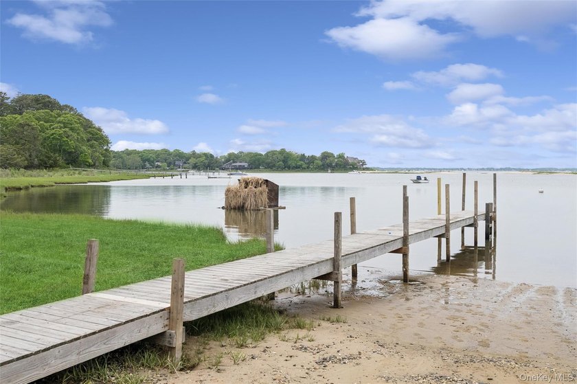 Set on a private 1.18-acre property in Hampton Bays, this - photo 33