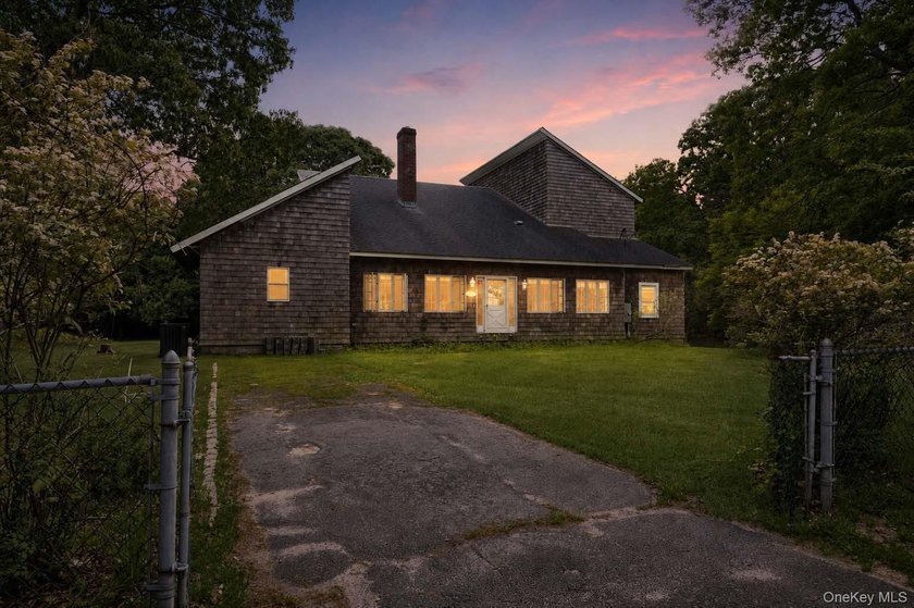Set on a private 1.18-acre property in Hampton Bays, this - photo 35