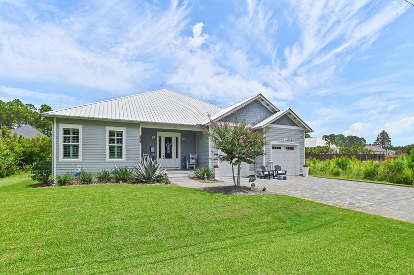 Escape to effortless coastal living in this bright and airy - photo 2