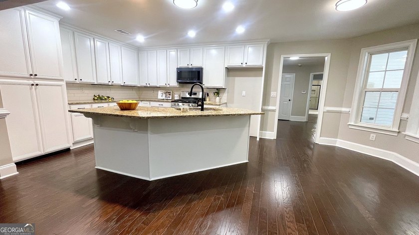Welcome home to this stately 4-sided brick ranch tucked away on - photo 28