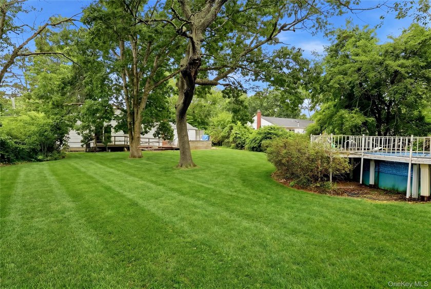 Located on a beautiful flat half-acre of property, this - photo 35