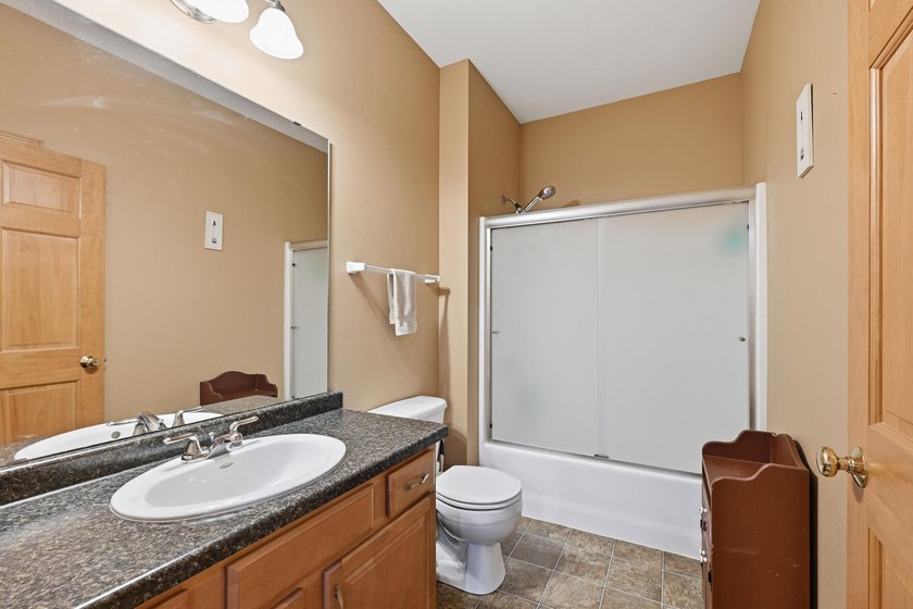 Stunning ranch condo in Waters Edge! Main level offers a - photo 17