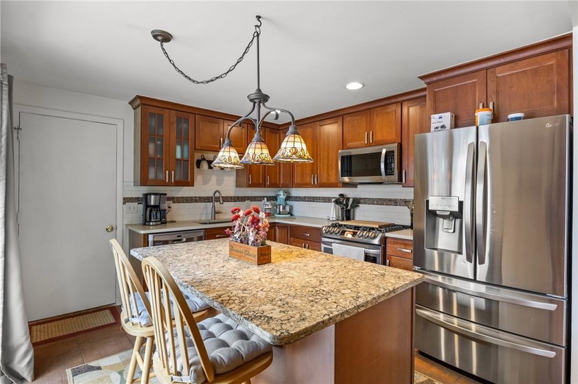 Welcome to your dream home nestled in the Town of Greece! This - photo 13