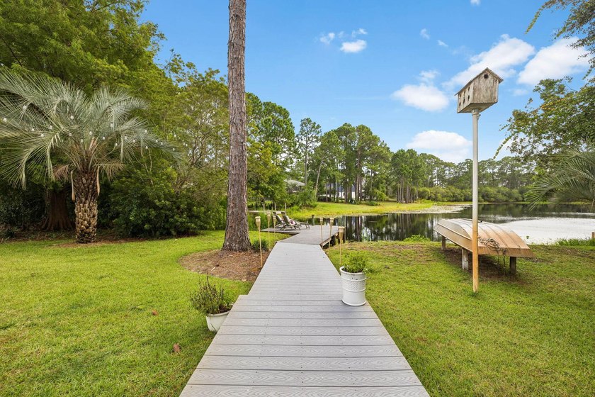 Nestled on a private one-acre homesite overlooking the tranquil - photo 3
