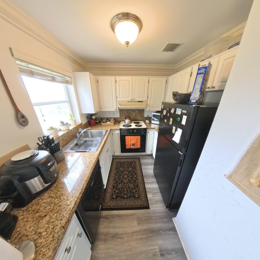 Step inside to find a spacious 2 bedroom condo featuring - photo 23