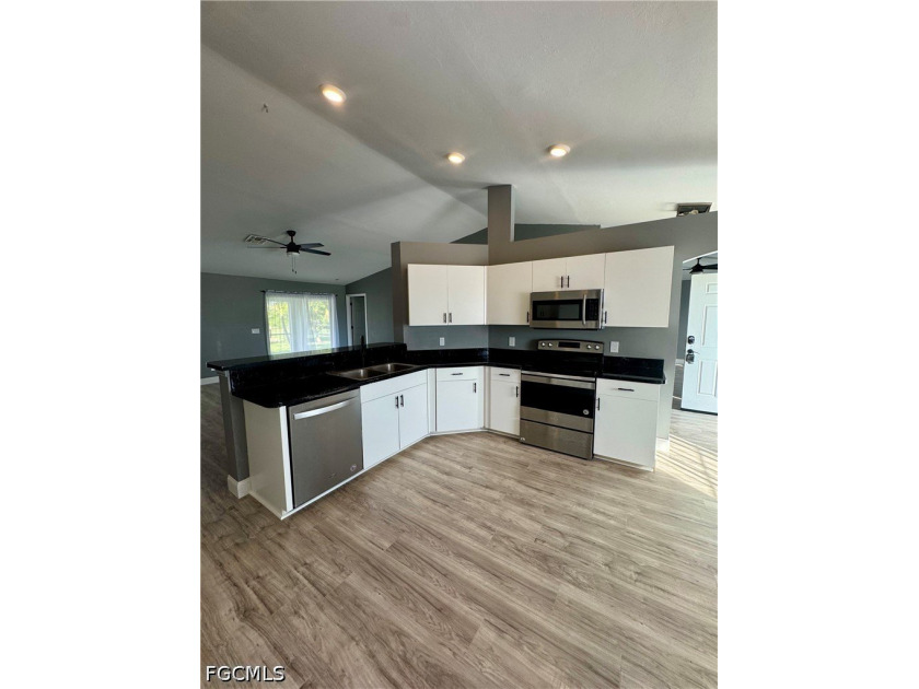 COME CHECK OUT THIS BEAUTIFULLY UPDATED home located in the - photo 4