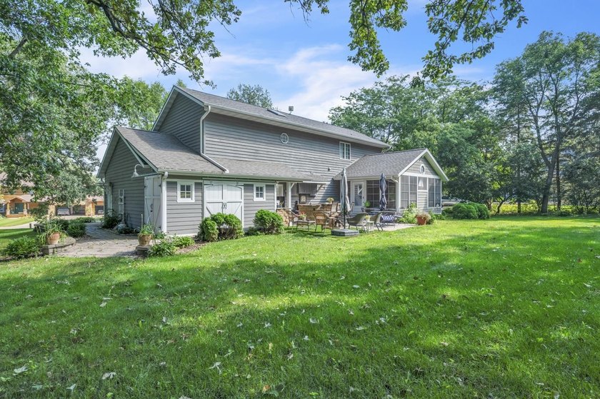 Just off East Okoboji Lake, nestled in the trees sits a - photo 39