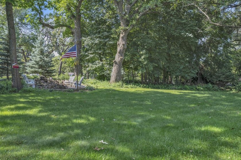 Just off East Okoboji Lake, nestled in the trees sits a - photo 42