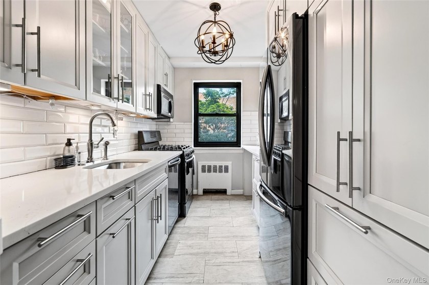 Let this unit sweep you off your feet! True three-bedroom, two - photo 24