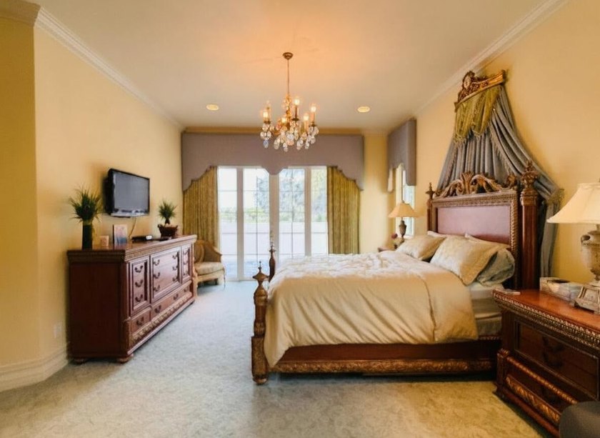 Commanding serene lakefront and double fairway vistas, this - photo 24