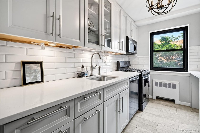 Let this unit sweep you off your feet! True three-bedroom, two - photo 25