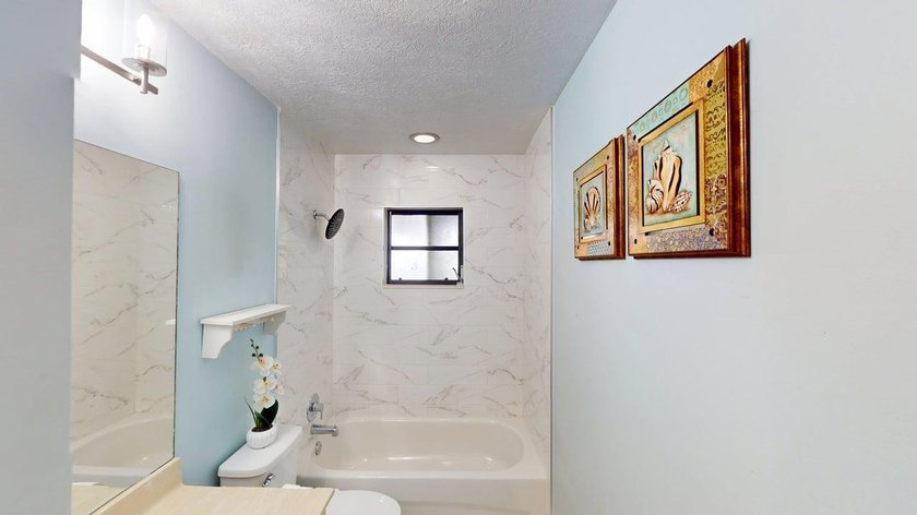 Welcome to this charming single-story residence located in Port - photo 32