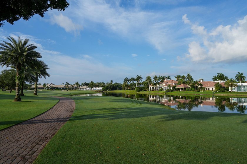 Commanding serene lakefront and double fairway vistas, this - photo 37
