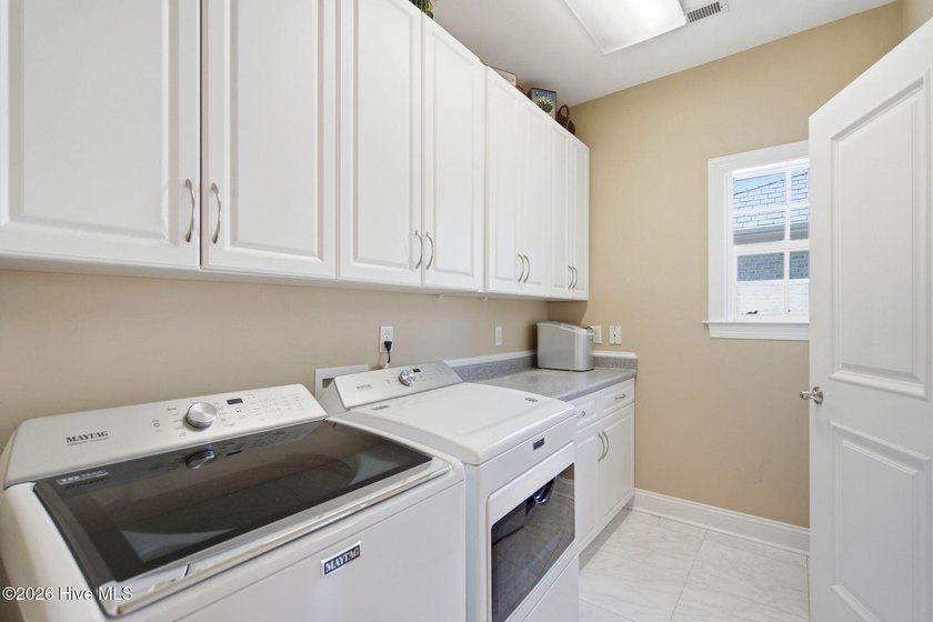 Welcome to 2118 Bay Colony Lane, an elegant 1.5-story brick - photo 27
