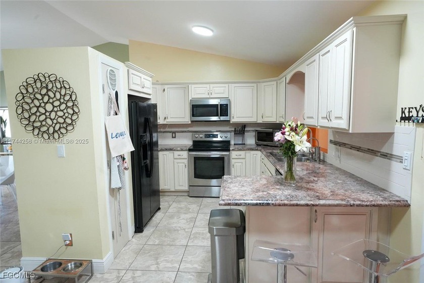 This inviting &amp; cozy 4-bedroom, 3-bathroom originally started as - photo 5