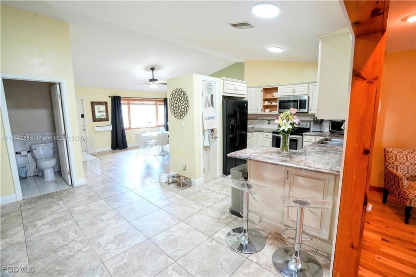 This inviting &amp; cozy 4-bedroom, 3-bathroom originally started as - photo 6