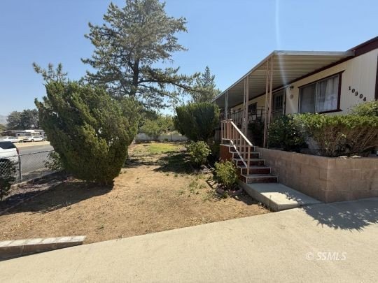 This inviting 1984 manufactured home, set on a permanent - photo 3