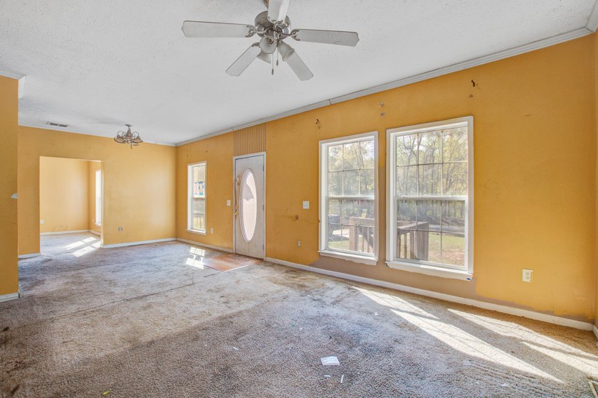 Three-bedroom, two-bath home situated on approximately 0.5 acres - photo 3