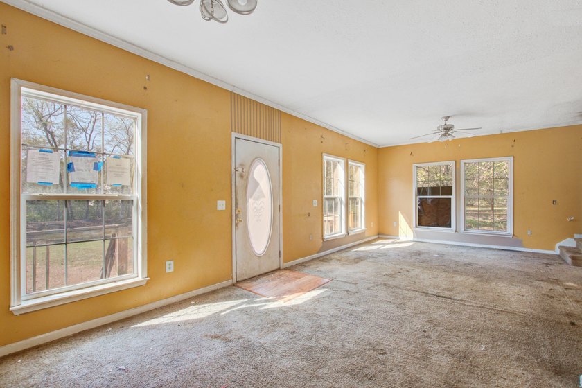 Three-bedroom, two-bath home situated on approximately 0.5 acres - photo 4