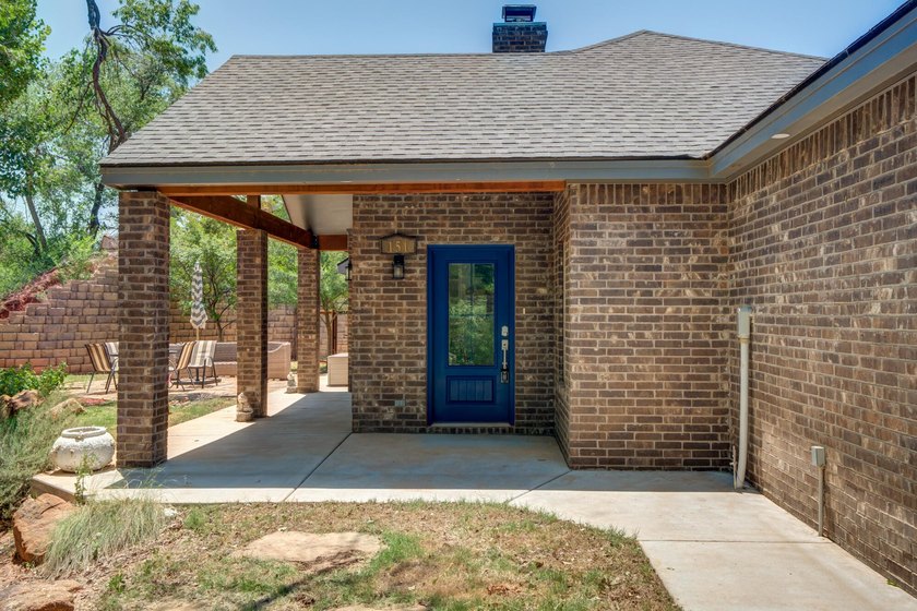 Surrounded by mature trees and overlooking Buffalo Springs Lake - photo 4