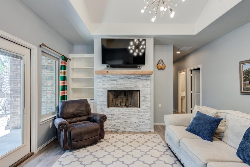 Surrounded by mature trees and overlooking Buffalo Springs Lake - photo 6