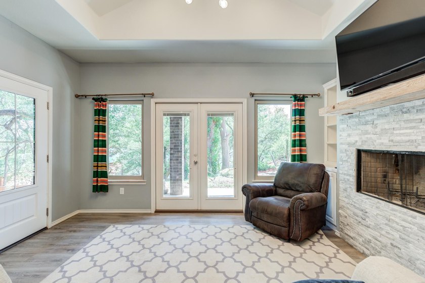 Surrounded by mature trees and overlooking Buffalo Springs Lake - photo 8
