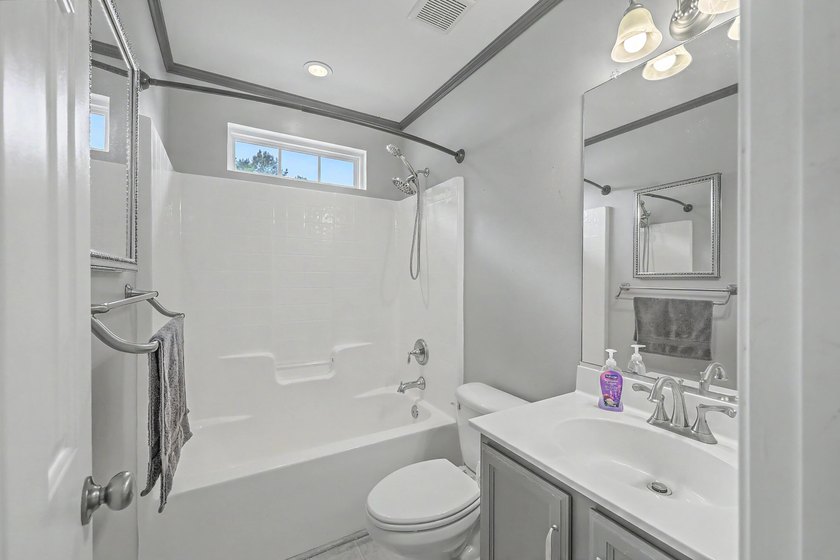 Nestled on a prime corner lot with serene pond views, this - photo 25