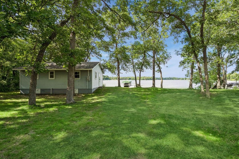 Discover a rare opportunity to own nearly an acre on Lake Julia - photo 2