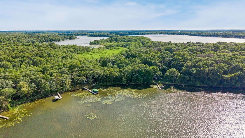 Discover a rare opportunity to own nearly an acre on Lake Julia - photo 10