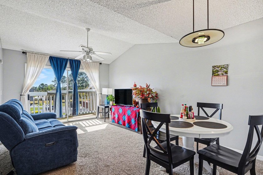 This 3-bedroom, 2-bathroom condo features a bright living room - photo 2