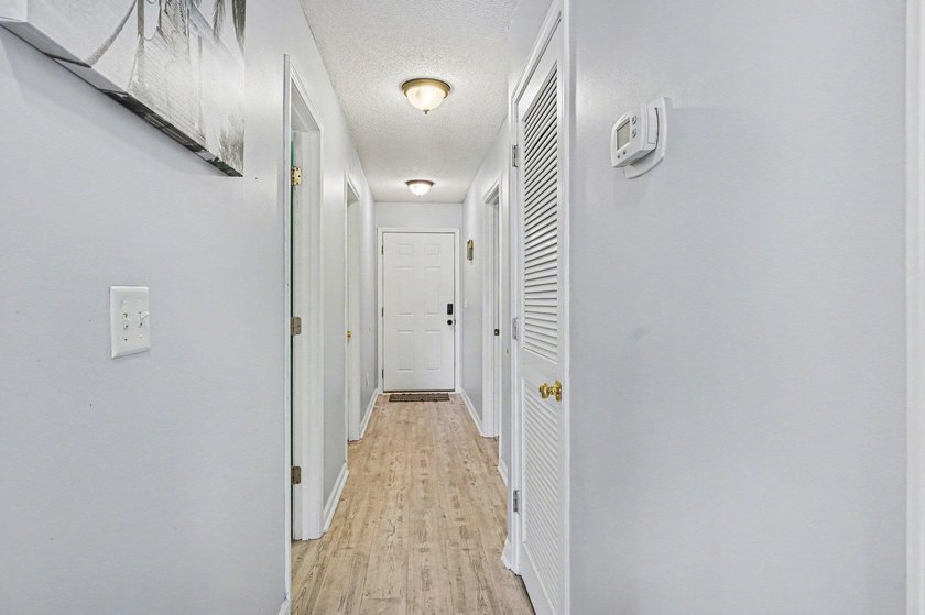 This 3-bedroom, 2-bathroom condo features a bright living room - photo 8