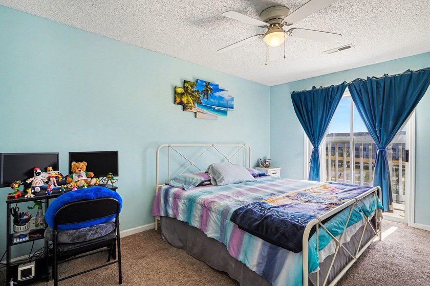 This 3-bedroom, 2-bathroom condo features a bright living room - photo 10